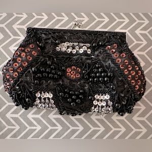 Small black floral clutch